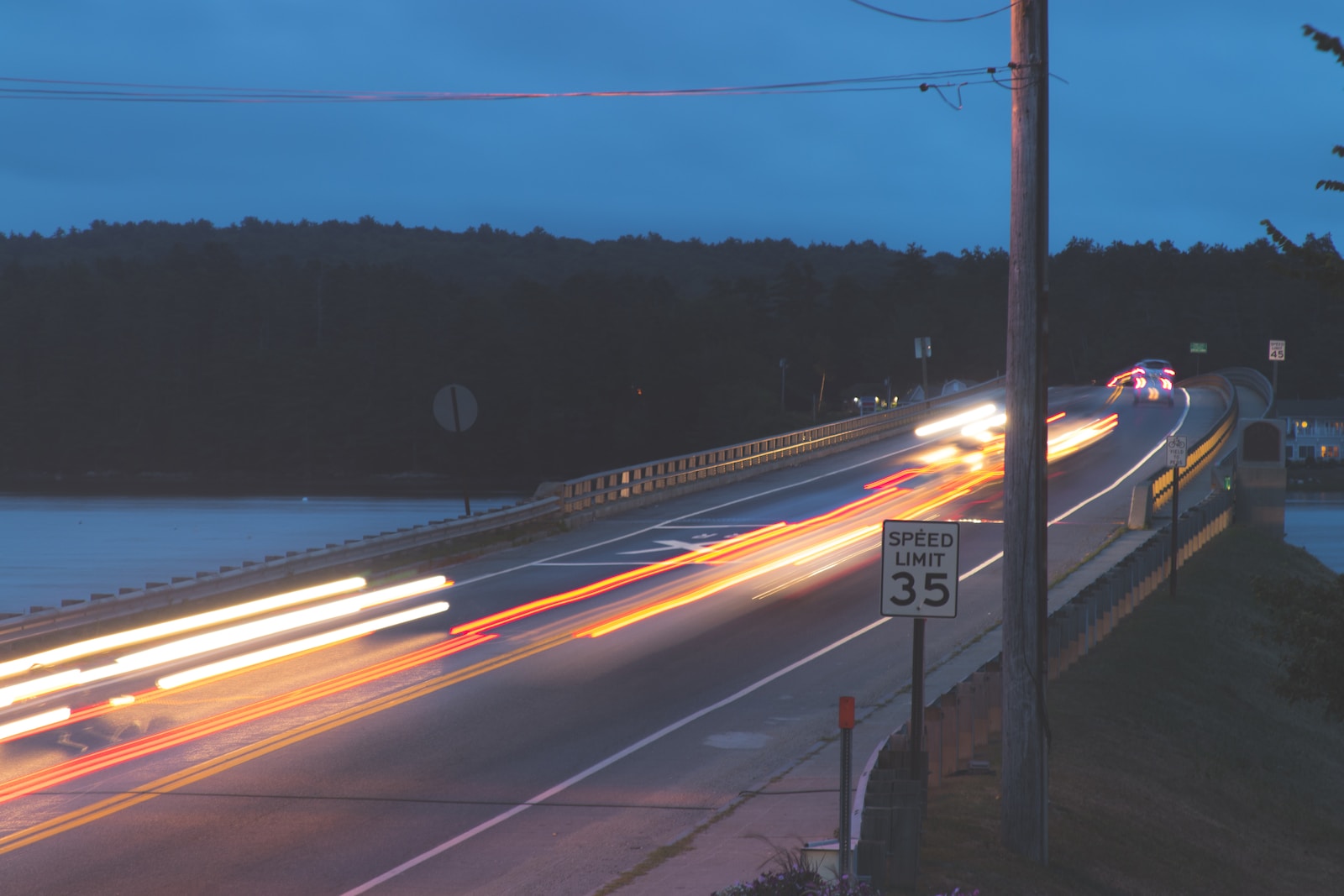 timelapse photography of vehicle passing on road