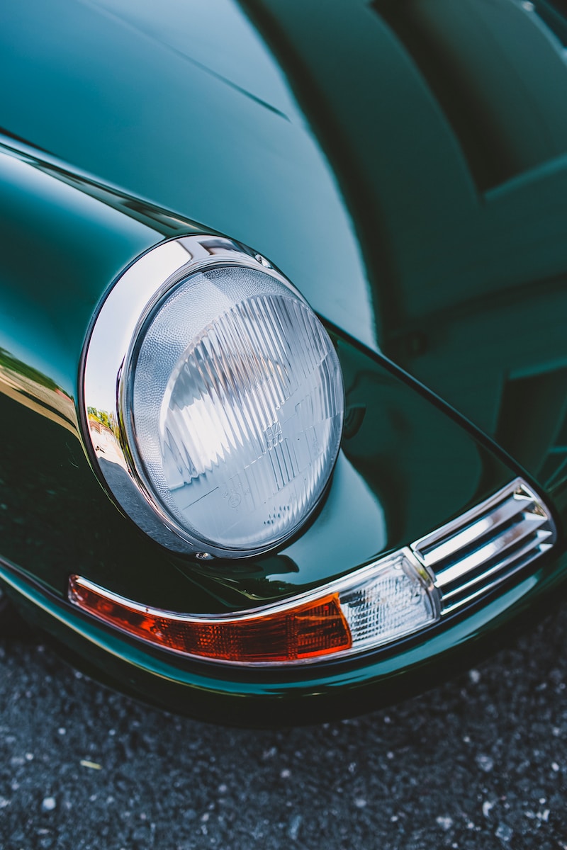 green car with chrome headlight